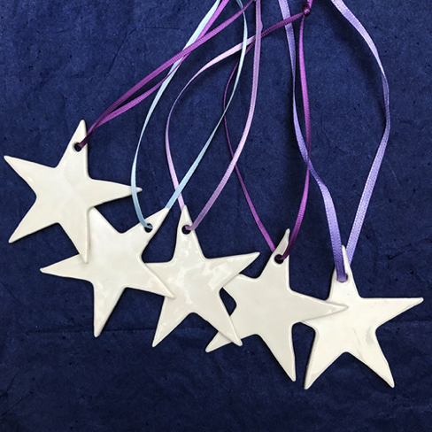 Small porcelain stars red ribbon £2.50